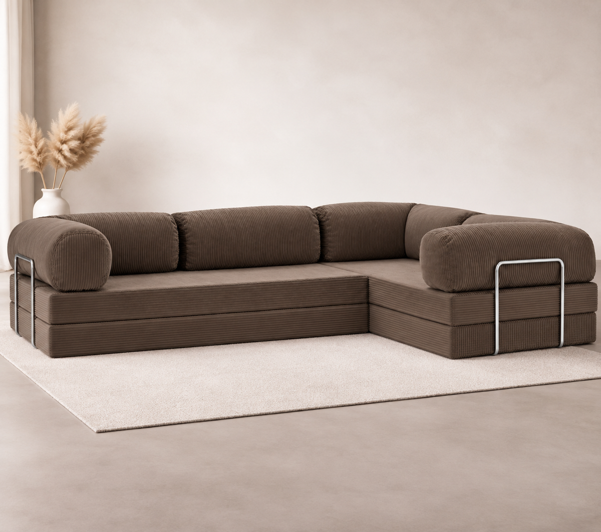 Confex Brown Corner Sofa displayed in a minimalist living room with rich brown corduroy upholstery, rounded armrests, plush cushions, soft beige rug and warm neutral interior styling.