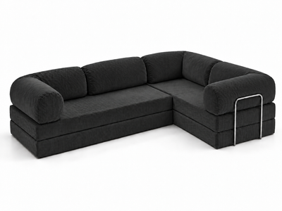 An elevated three-quarter view of the Confex Corner Black Sofa reveals the L-shaped seat arrangement, dark upholstered cushions and rounded end sections accented with slim rectangular metal details.