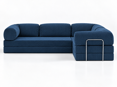 The front-facing view of the Confex Corner Blue Sofa shows dark blue seat and back cushions on a white background, with the projecting section to the right and rounded arms edged by metal accents.