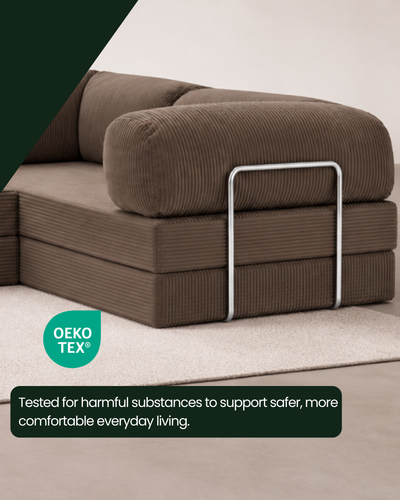 Close-up of the Confex Brown Corner Sofa showcasing its rich chocolate brown corduroy upholstery, distinctive ribbed fabric texture, precise stitching and rounded armrest details.